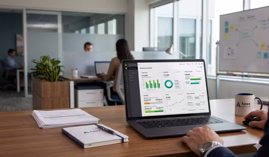 A quickbooks payroll review dashboard can be seen on a laptop in a corporate environment
